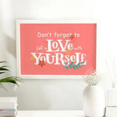 Love Yourself First Frame - Self-Love Gift in white frame on pink background, ideal for home decor or birthday gifts for her or him.